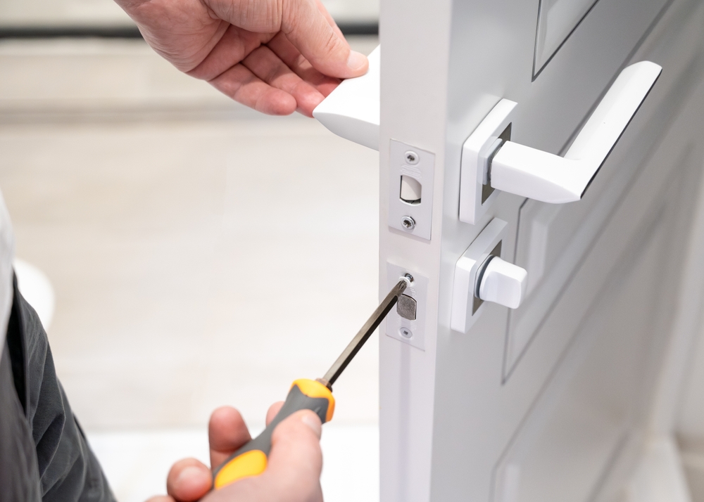 Contact Locksmith Sunshine Coast technician repairing a door lock
